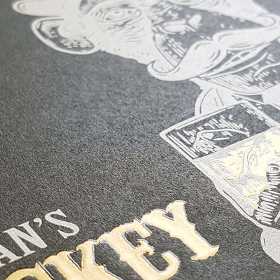 Black Vellum uncoated specialty material with gold foil and embossing